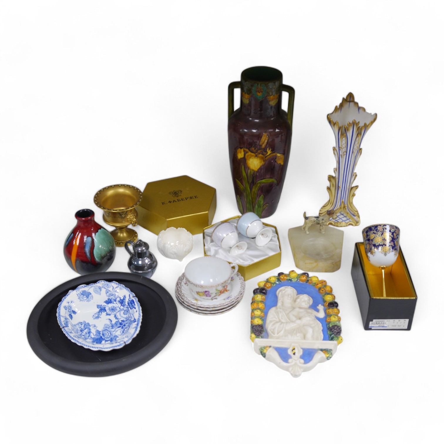 A collection of ornamental china including boxed Royal Collection Faberge egg cups, a Della Robbia style plaque, a gilt Royal Worcester pedestal vase, a Poole pottery vase and a terrier ashtray etc., tallest 31cm (17). C